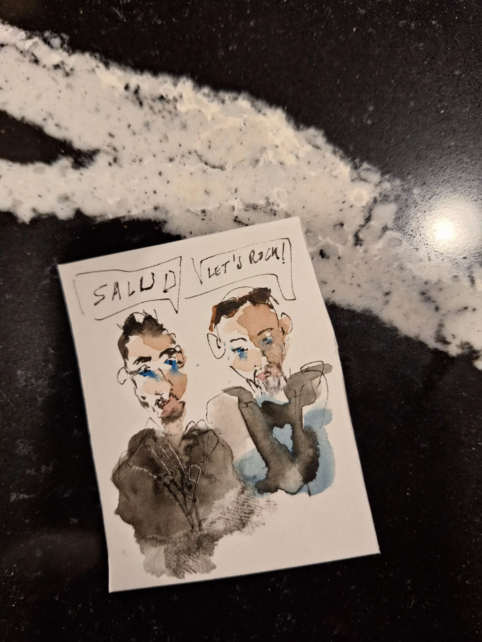 Een karikatuur van twee van ons, getekend aan de toog