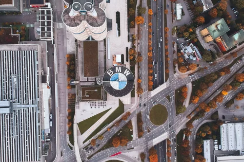 Aerial view of BMW headquarters in Munich, with the logo on the museum roof